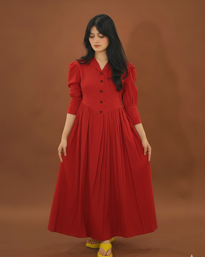 Woman wearing a red dress against a brown background