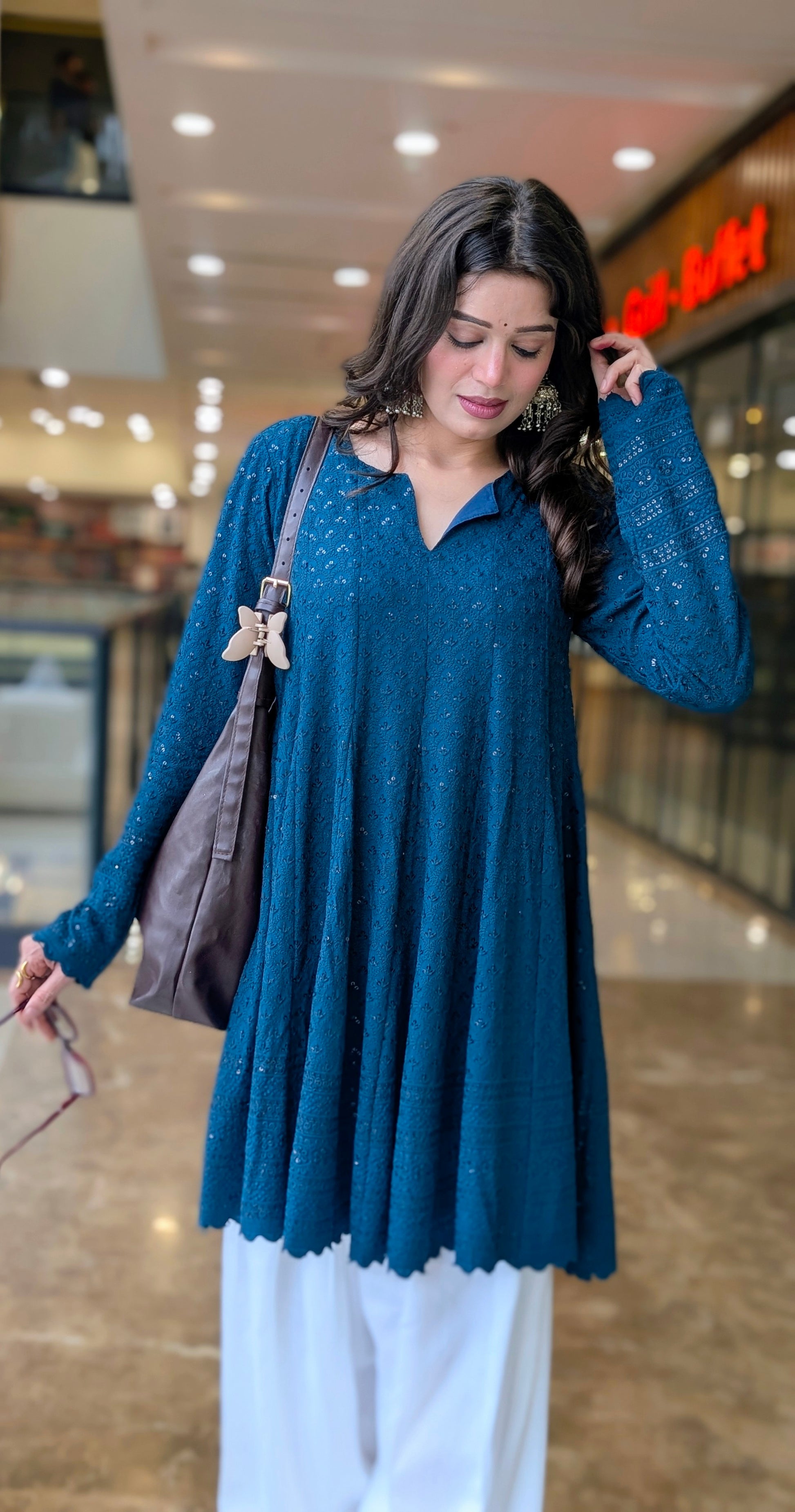 Teal Schiffli embroidered peplum kurta with white farshi salwar 