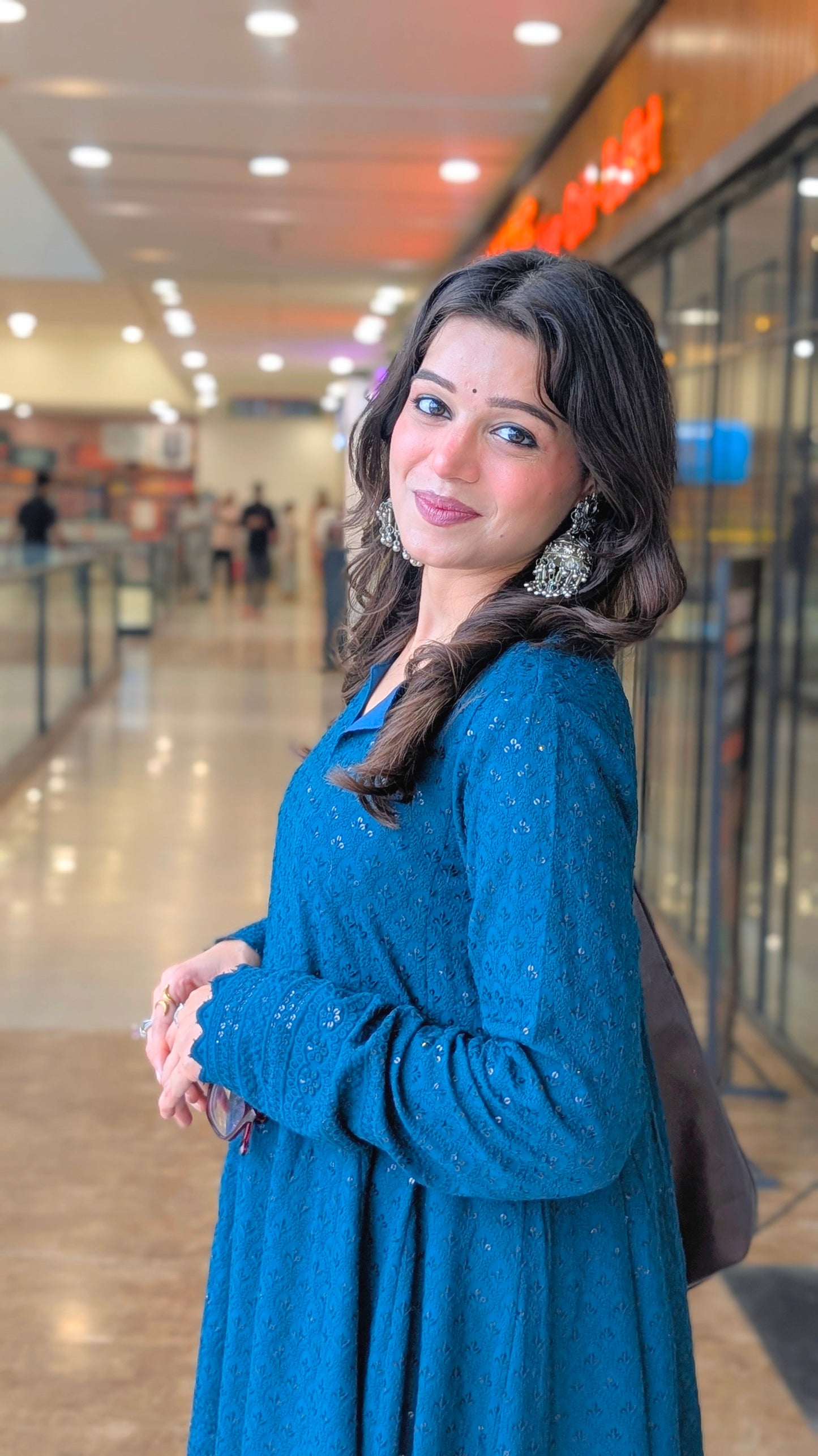 Teal Schiffli embroidered peplum kurta with white farshi salwar 