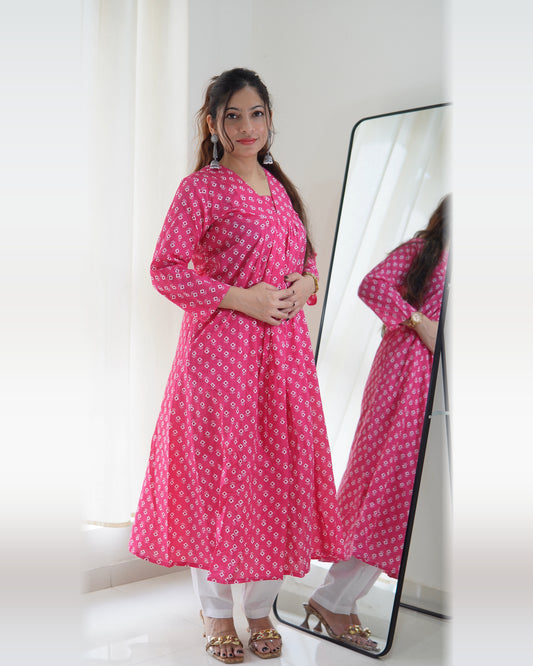 Pink cotton printed A-line kurta pant set with V-neck and 3/4 sleeves, front view with white pants and gold heels – Vastramaniaa