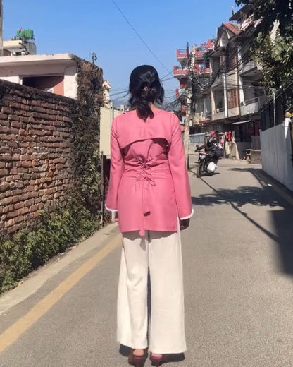 Person wearing a pink kurthi on a street with text overlay